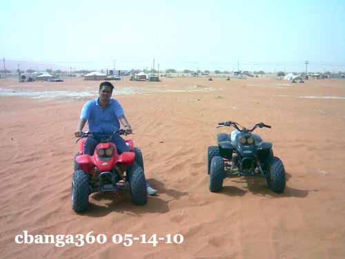 riding an ATV on the red sands of Saudi