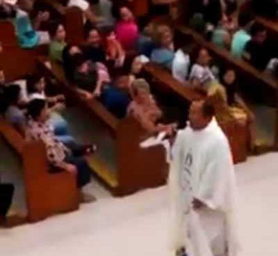 Parish priest rides hoverboard while singing inside church services