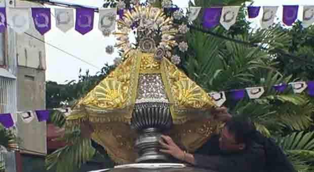 The venerated image (replica) of the Virgin of Penafrancia, being installed pror to the street and fluvial procession that start from the cathedral after the mass which concludes at 3 pm.